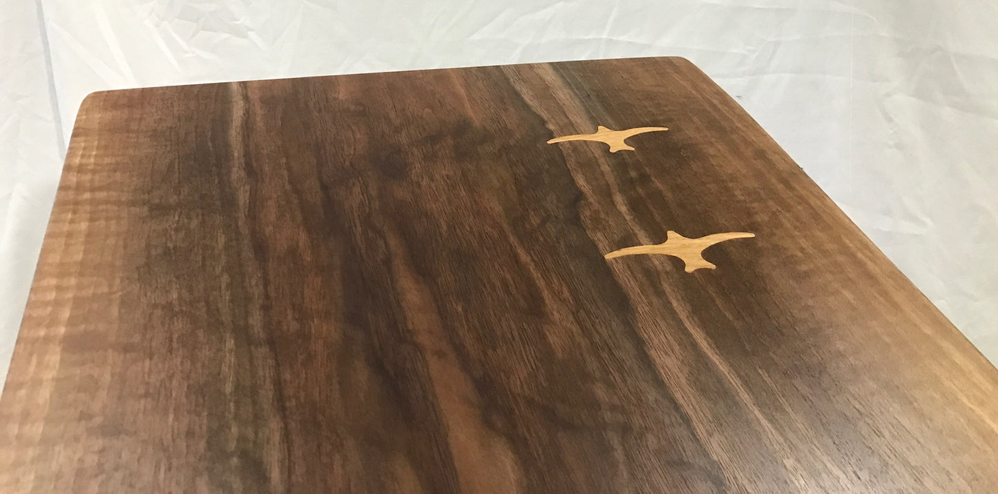 live edge walnut coffee table showing white oak seabird inlay close up partial view