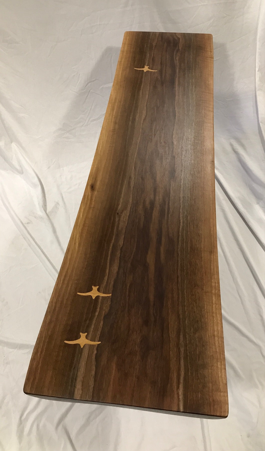 live edge walnut narrow coffee table with white oak seabird inlay-top view 1